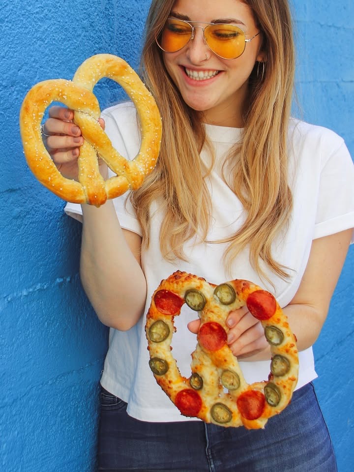 Guest enjoying original and specialty Wetzel’s pretzels